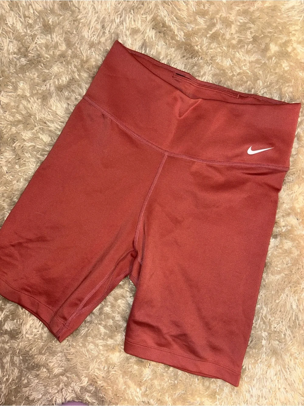 Nike High-Rise Bike Shorts in Rust Red 7 inch